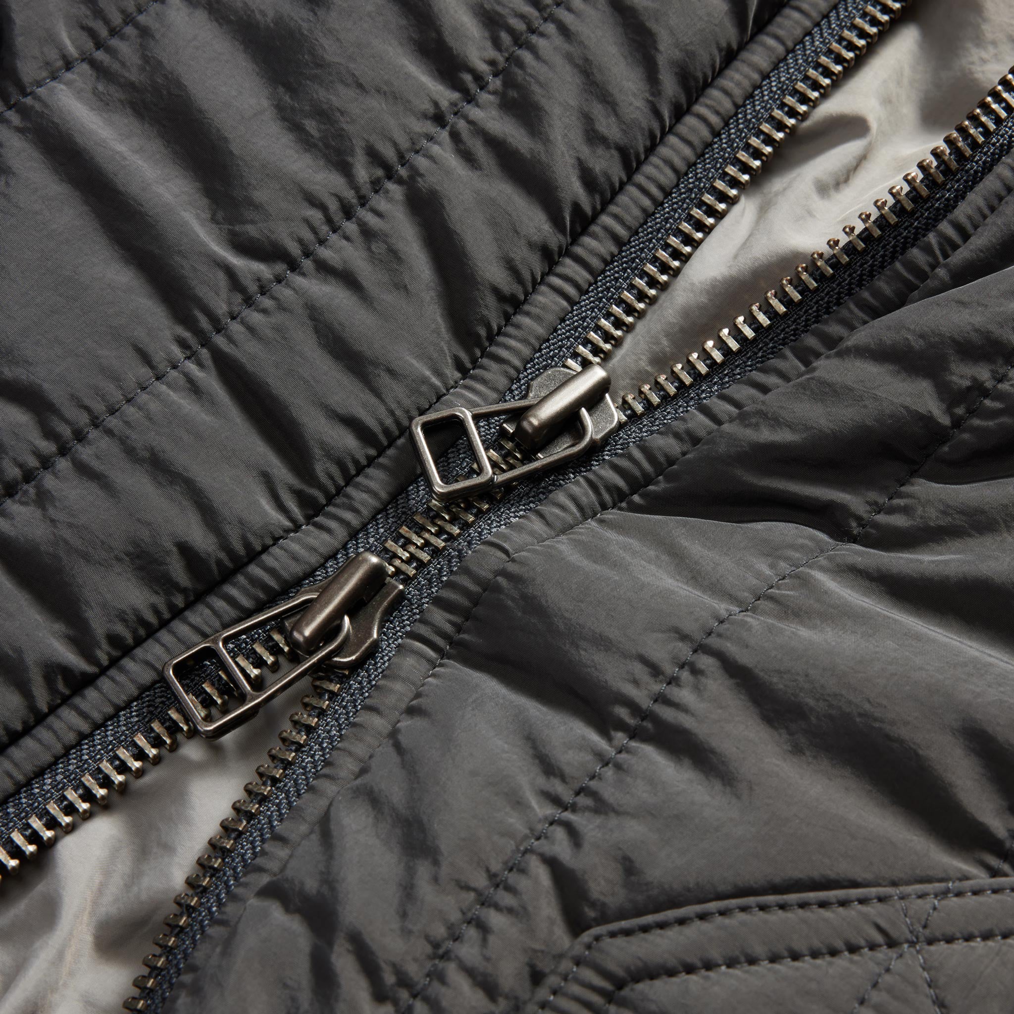 The Able Jacket in Faded Black Quilted Nylon - Image 8